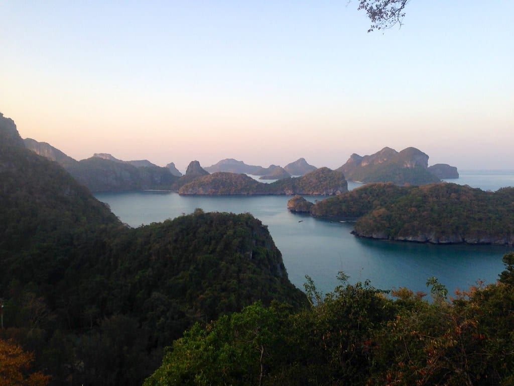 Elevated panoramic view of lush green karst islands scattered across calm turquoise waters in Ang Thong National Marine Park.